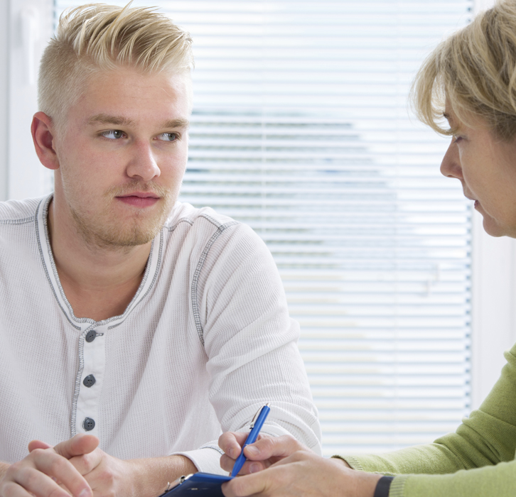 Young man talking with a therapist - What is FASD?