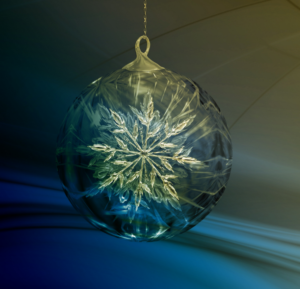 picture of glass ornament with snowflake on blue background